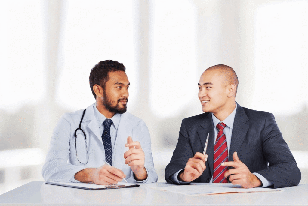 A medical professional and a salesperson discussing equipment procurement.
